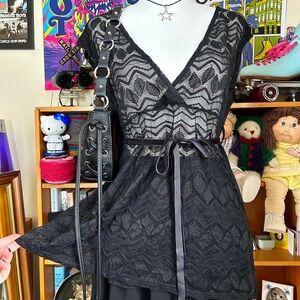 Black lace short sleeve babydoll top with belted waist and sheer pattern